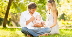 Parents with infant child outdoors